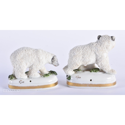 564 - A PAIR OF ANTIQUE ANTLERS together with two staffordshire polar bears. Largest 18cm x 12 cm. (3)