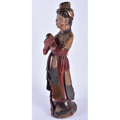 566 - AN 18TH/19TH CENTURY CHINESE LACQUERED WOOD FIGURE OF AN IMMORTAL Qing. 41 cm high.