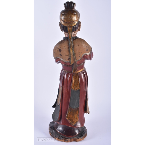 566 - AN 18TH/19TH CENTURY CHINESE LACQUERED WOOD FIGURE OF AN IMMORTAL Qing. 41 cm high.