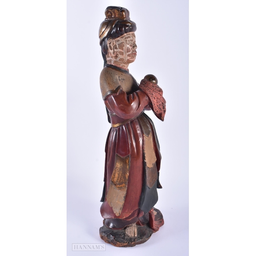 566 - AN 18TH/19TH CENTURY CHINESE LACQUERED WOOD FIGURE OF AN IMMORTAL Qing. 41 cm high.