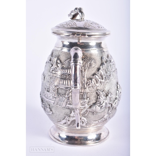 570 - A LATE 19TH CENTURY CHINESE TWIN HANDLED SILVER JAR AND COVER Late Qing. 150 grams. 11cm high.