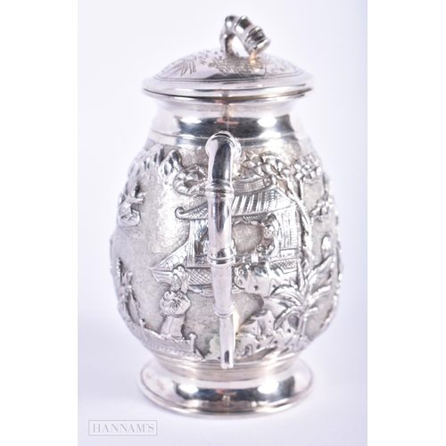 570 - A LATE 19TH CENTURY CHINESE TWIN HANDLED SILVER JAR AND COVER Late Qing. 150 grams. 11cm high.