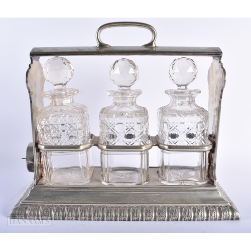 581 - A LARGE ANTIQUE WALKER AND HALL SILVER PLATED GLASS TANTALUS. 35 cm x 24 cm.