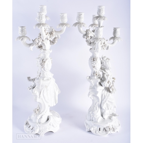 582 - A LARGE PAIR OF LATE 19TH CENTURY GERMAN BLANC DE CHINE CANDLESTICKS. 58 cm x 16 cm.