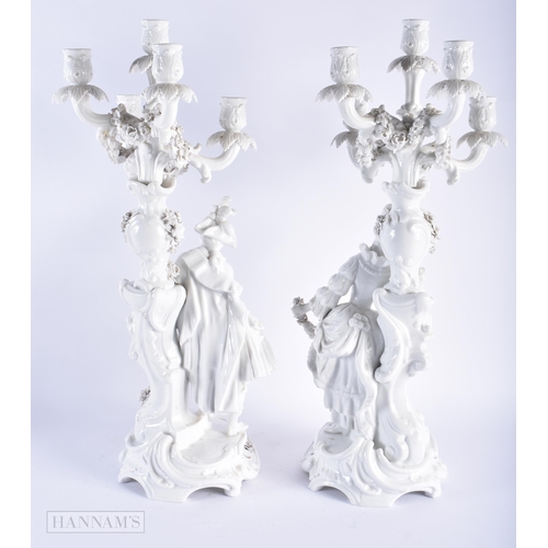 582 - A LARGE PAIR OF LATE 19TH CENTURY GERMAN BLANC DE CHINE CANDLESTICKS. 58 cm x 16 cm.