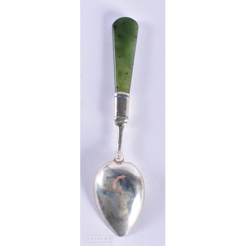 587 - A CONTINENTAL SILVER AND JADE SPOON. 9 grams. 10 cm long.