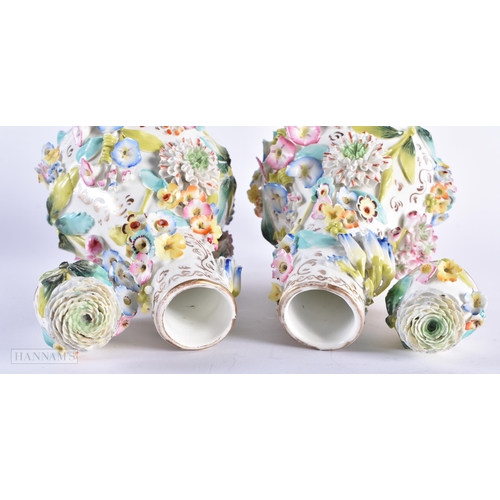 594 - A PAIR OF MID 19TH CENTURY ENGLISH PORCELAIN VASES AND COVER encrusted with flowers. 28cm high.