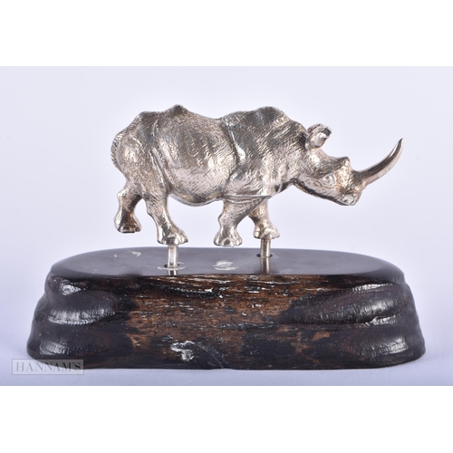 595 - AN ENGLISH SILVER MODEL OF A RHINO by Patrick Mavros. Rhino not inc stand 193 grams. 10 cm x 7 cm.