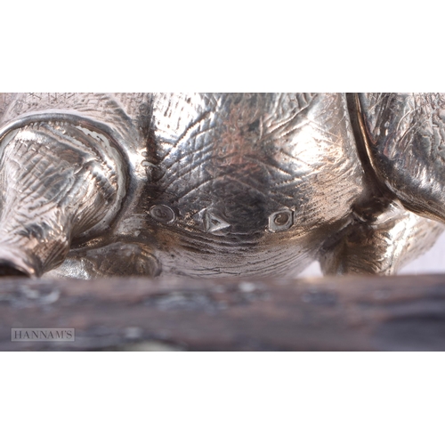 595 - AN ENGLISH SILVER MODEL OF A RHINO by Patrick Mavros. Rhino not inc stand 193 grams. 10 cm x 7 cm.