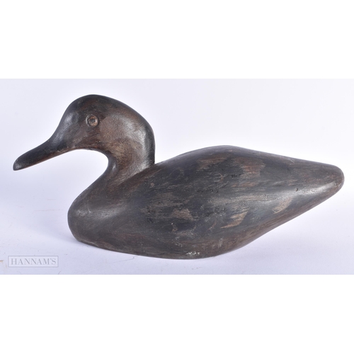 6 - AN EARLY 20TH CENTURY CARVED WOOD DUCK DECOY. 27cm wide.