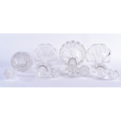 604 - FOUR GLASS DECANTERS AND STOPPERS. Largest 33cm wide. (4)