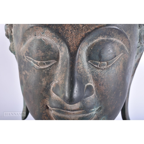 627 - A LARGE SOUTH EAST ASIAN BRONZE BUDDHA HEAD. 45cm high.