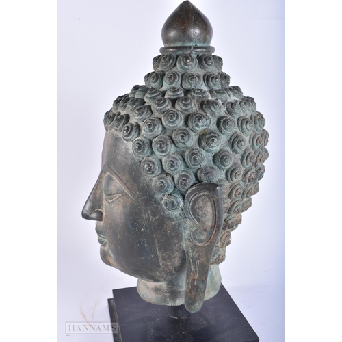 627 - A LARGE SOUTH EAST ASIAN BRONZE BUDDHA HEAD. 45cm high.