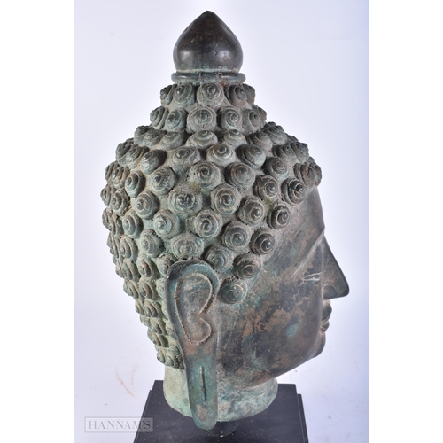 627 - A LARGE SOUTH EAST ASIAN BRONZE BUDDHA HEAD. 45cm high.