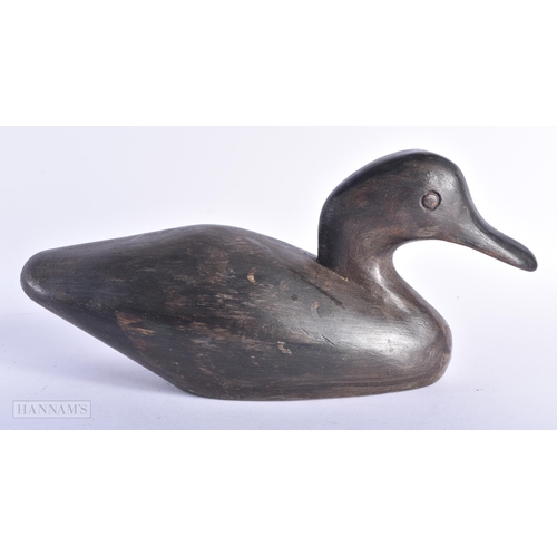 6 - AN EARLY 20TH CENTURY CARVED WOOD DUCK DECOY. 27cm wide.