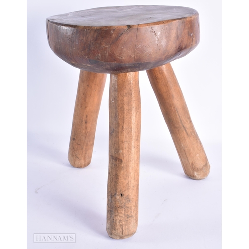 64 - AN ANTIQUE DAIRY MILKING STOOL. 35 cm x 24 cm.