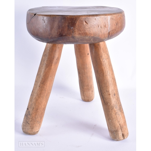 64 - AN ANTIQUE DAIRY MILKING STOOL. 35 cm x 24 cm.