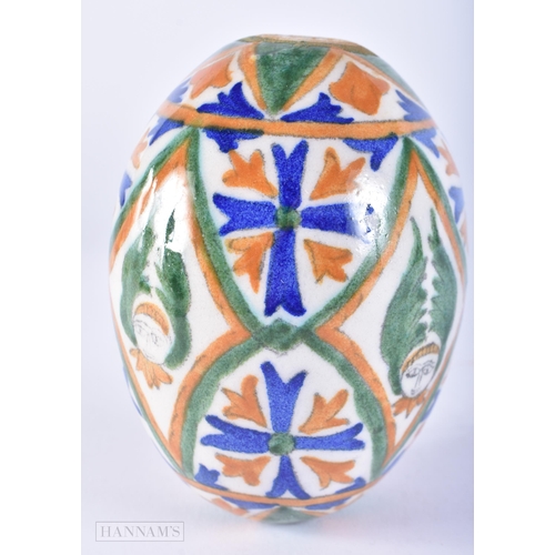 645 - AN ARMENIAN CERAMIC KUTAHYA EGG. 11cm x 7 cm.