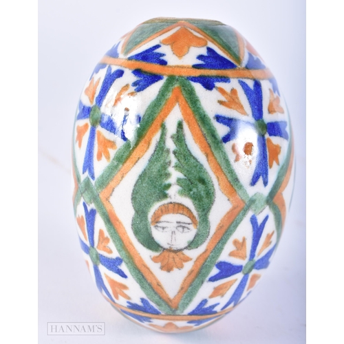 645 - AN ARMENIAN CERAMIC KUTAHYA EGG. 11cm x 7 cm.