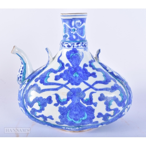 651 - A TURKISH IZNIK POTTERY WINE EWER. 18cm x 17 cm.