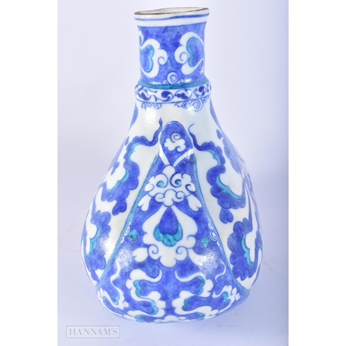 651 - A TURKISH IZNIK POTTERY WINE EWER. 18cm x 17 cm.