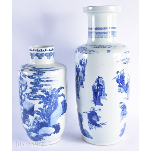 666 - A CHINESE DYNASTY BLUE AND WHITE PORCELAIN ROULEAU VASE together with a similar large rouleau vase, ... 