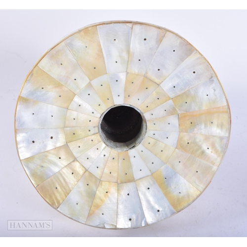 670 - AN INDIAN GOA MOTHER OF PEARL INLAID CANDLESTICK. 23 cm x 16 cm.