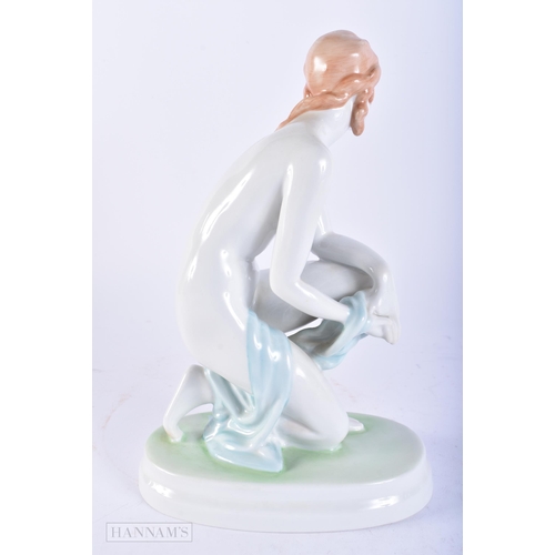 673 - A ZSOLNAY PECS HUNGARIAN PORCELAIN FIGURE OF A NUDE FEMALE. 22cm high.