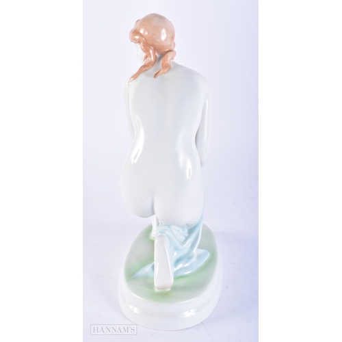 673 - A ZSOLNAY PECS HUNGARIAN PORCELAIN FIGURE OF A NUDE FEMALE. 22cm high.