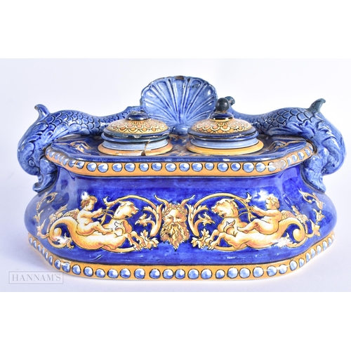 70 - A 19TH CENTURY ITALIAN MAJOLICA COUNTRY HOUSE INKWELL AND COVER painted with figures riding mythical... 