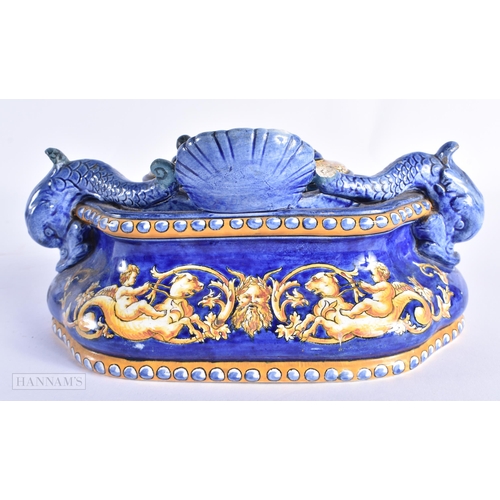 70 - A 19TH CENTURY ITALIAN MAJOLICA COUNTRY HOUSE INKWELL AND COVER painted with figures riding mythical... 