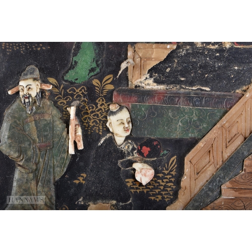 703 - A 19TH CENTURY CHINESE BLACK LACQUER SOAPSTONE SCREEN decorated with figures in various pursuits. 90... 