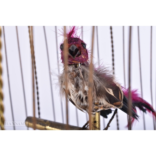 705 - A LARGE 19TH CENTURY EUROPEAN GILT METAL CASED AUTOMATON SINGING BIRD CAGE. 52 cm x 20 cm.