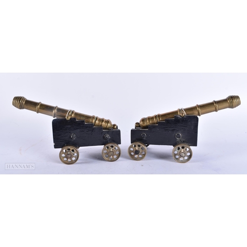 718 - A PAIR OF ANTIQUE GENTLEMAN'S BRONZE DESK CANNONS. 15cm wide.