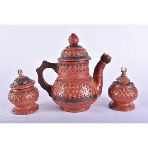 720 - A TURKISH TOPHANE POTTERY TEASET. Largest 17 cm high. (3)