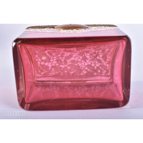 724 - AN ANTIQUE CRANBERRY GLASS ENAMELLED CASKET. 9.75 cm x 9 cm.