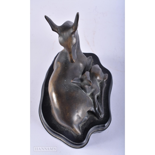 727 - A BRONZE DEER SCULPTURE. 18cm x 15cm.