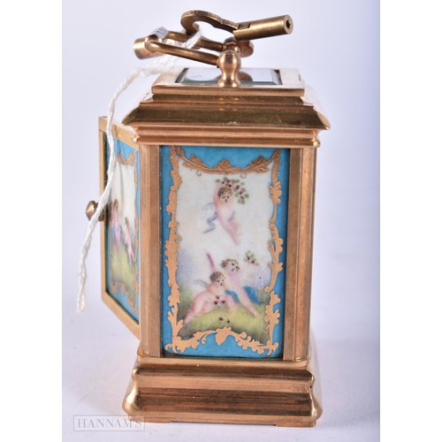 729 - A MINIATURE SEVRES STYLE CARRIAGE CLOCK. 10 cm high inc handle. Running