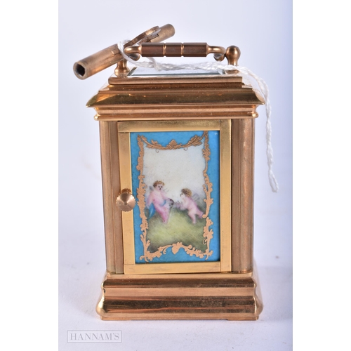 729 - A MINIATURE SEVRES STYLE CARRIAGE CLOCK. 10 cm high inc handle. Running