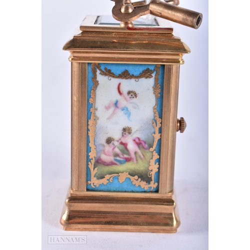 729 - A MINIATURE SEVRES STYLE CARRIAGE CLOCK. 10 cm high inc handle. Running