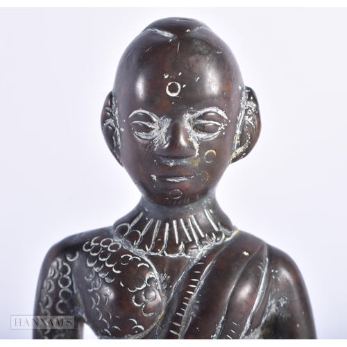 76 - AN EARLY INDIAN BRONZE FIGURE OF A HINDU DEITY. 14cm high.