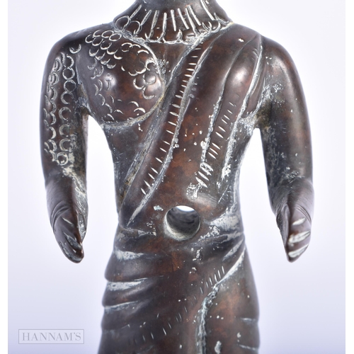 76 - AN EARLY INDIAN BRONZE FIGURE OF A HINDU DEITY. 14cm high.