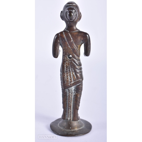 76 - AN EARLY INDIAN BRONZE FIGURE OF A HINDU DEITY. 14cm high.