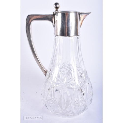 766 - AN ANTIQUE CONTINENTAL SILVER CUT GLASS CLARET JUG. 28cm high.