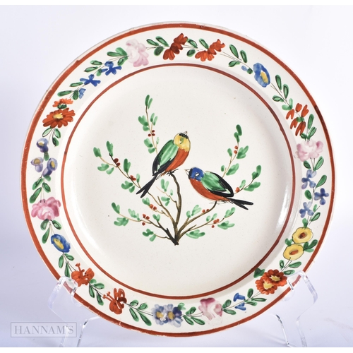 83 - A PAIR OF 18TH CENTURY ENGLISH CREAMWARE POTTERY PLATES painted with birds. 21 cm diameter.