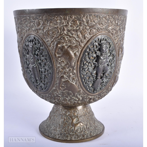 95 - A LARGE 19TH CENTURY INDIAN BRONZE AND COPPER ALLOY PEDESTAL VASE decorated with panels of hindu dei... 