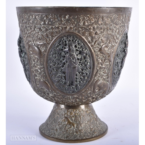 95 - A LARGE 19TH CENTURY INDIAN BRONZE AND COPPER ALLOY PEDESTAL VASE decorated with panels of hindu dei... 