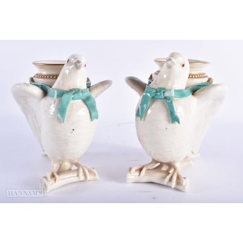 97 - A RARE PAIR OF ROYAL WORCESTER PORCELAIN BIRD VASES painted with flowers. 17 cm x 13 cm.