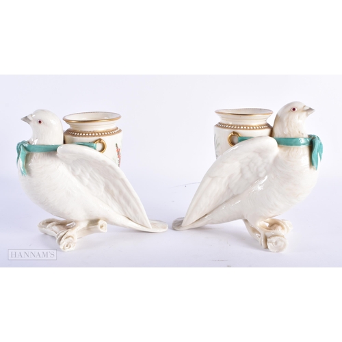 97 - A RARE PAIR OF ROYAL WORCESTER PORCELAIN BIRD VASES painted with flowers. 17 cm x 13 cm.