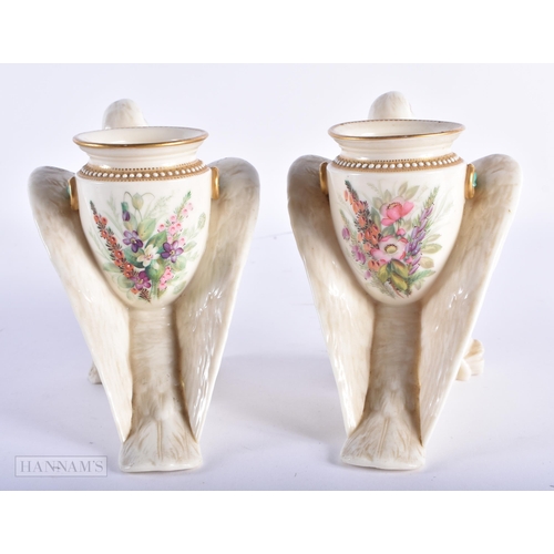 97 - A RARE PAIR OF ROYAL WORCESTER PORCELAIN BIRD VASES painted with flowers. 17 cm x 13 cm.